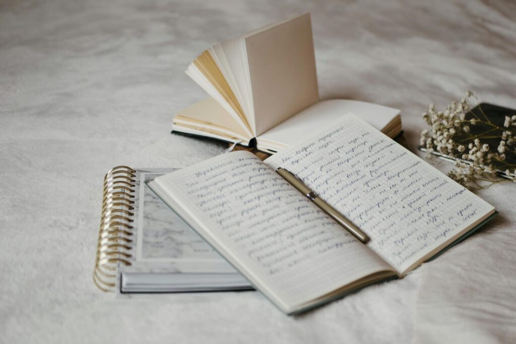 an open notebook with pen